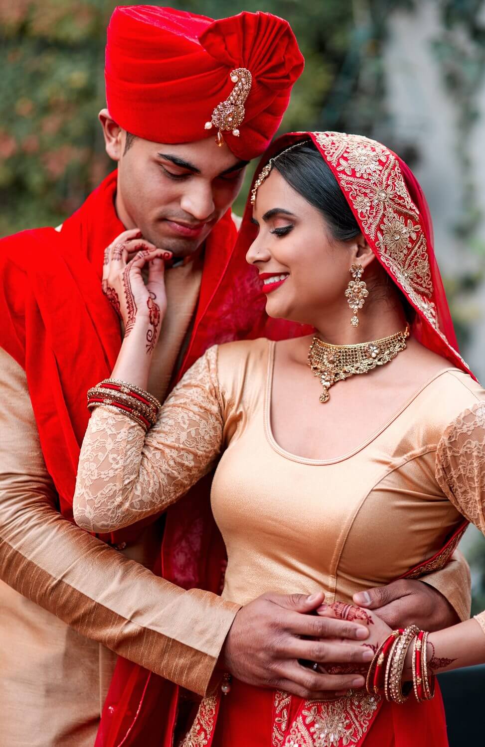 South Asian bride in traditional red and gold bridal attire on her wedding day in New Jersey, photographed by Michael Taramona Productions