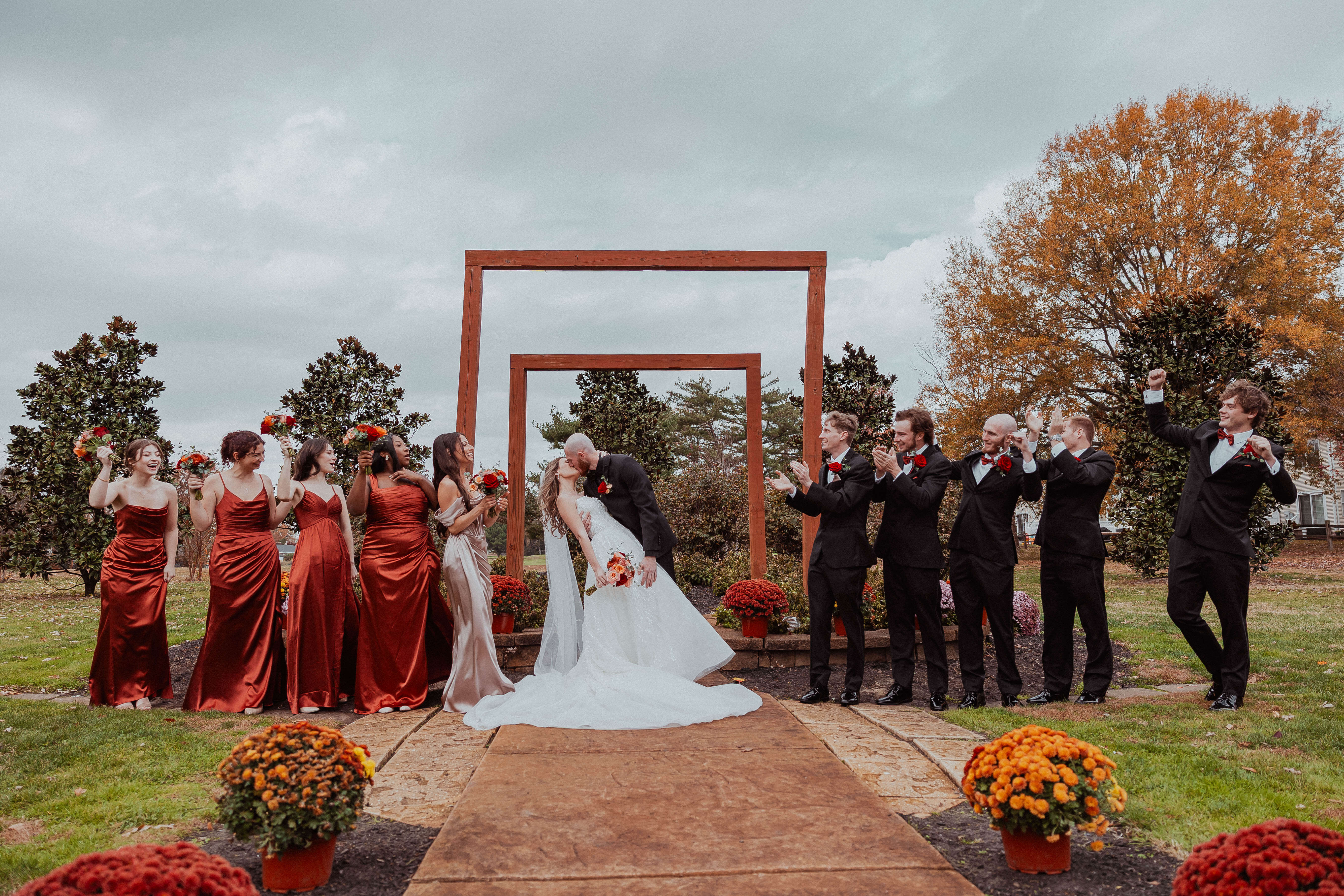 Destiny and Allen kiss at the altar with their wedding party at Ron Jaworski's Valleybrook Country Club in Blackwood, NJ